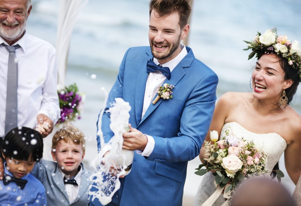 young-couple-in-a-wedding-ceremony-at-the-beach.jpg